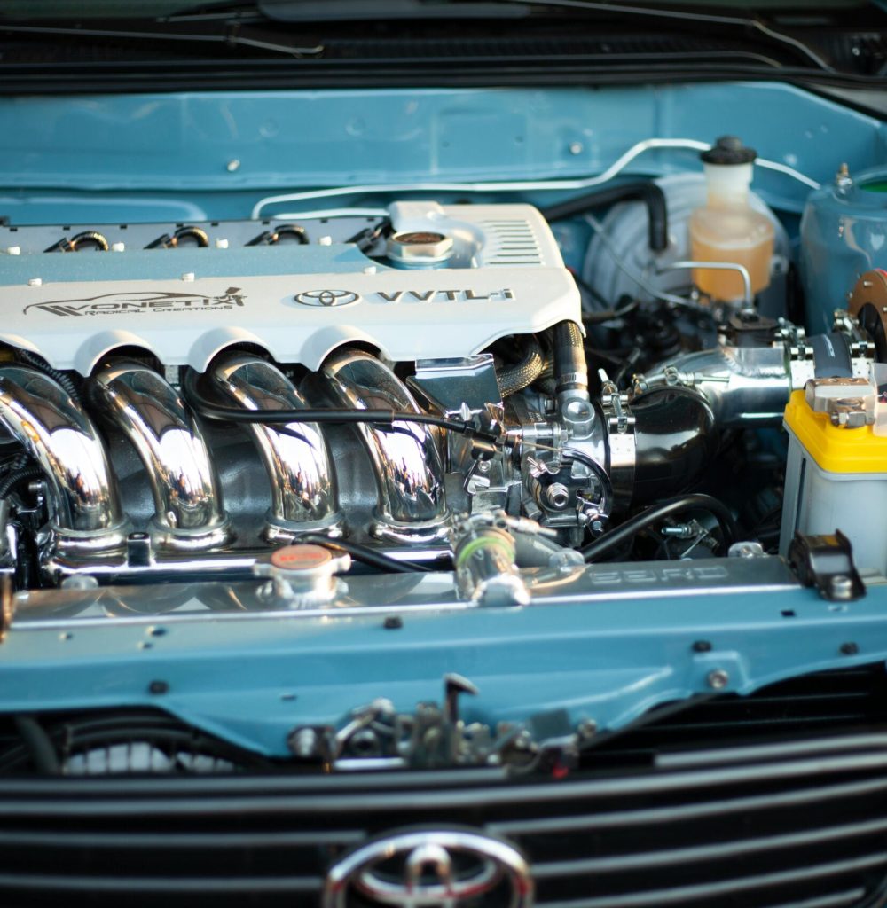 Detailed view of a shiny and powerful Toyota engine, showcasing automotive engineering.